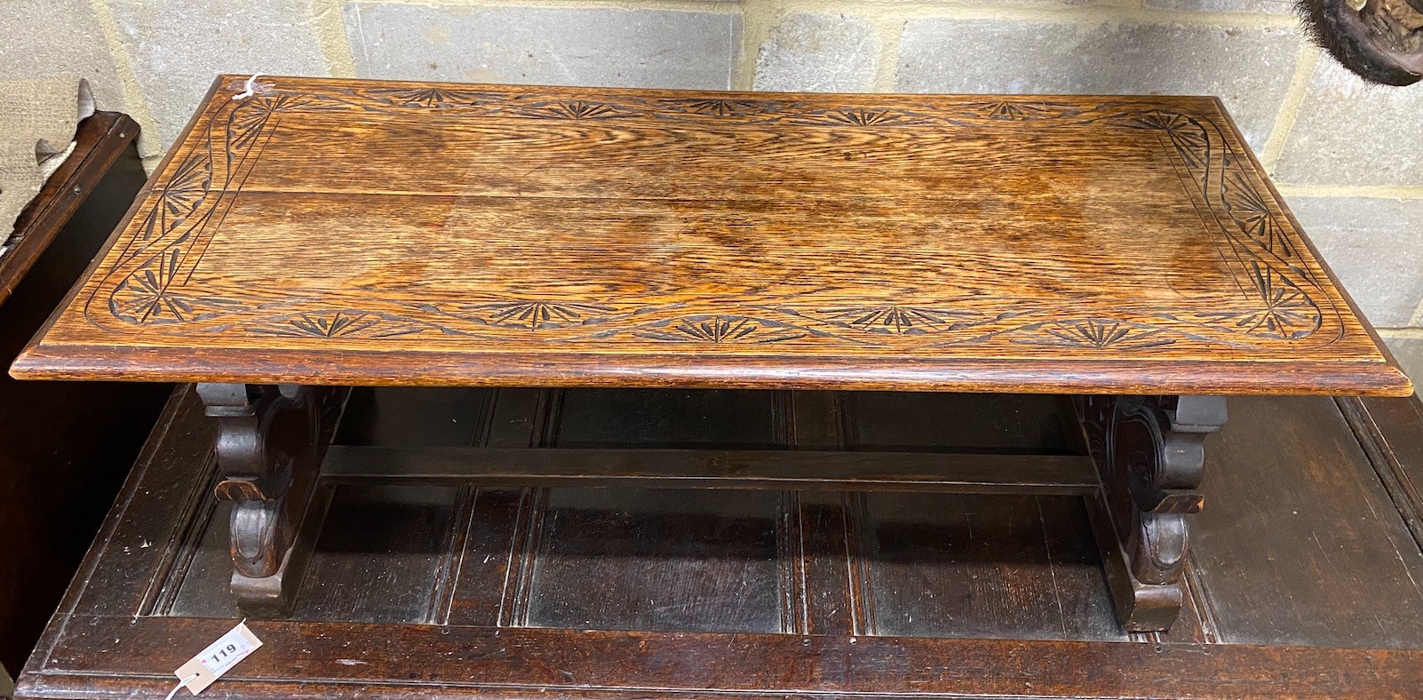 A rectangular carved oak coffee table, length 104cm, depth 44cm, height 39cm